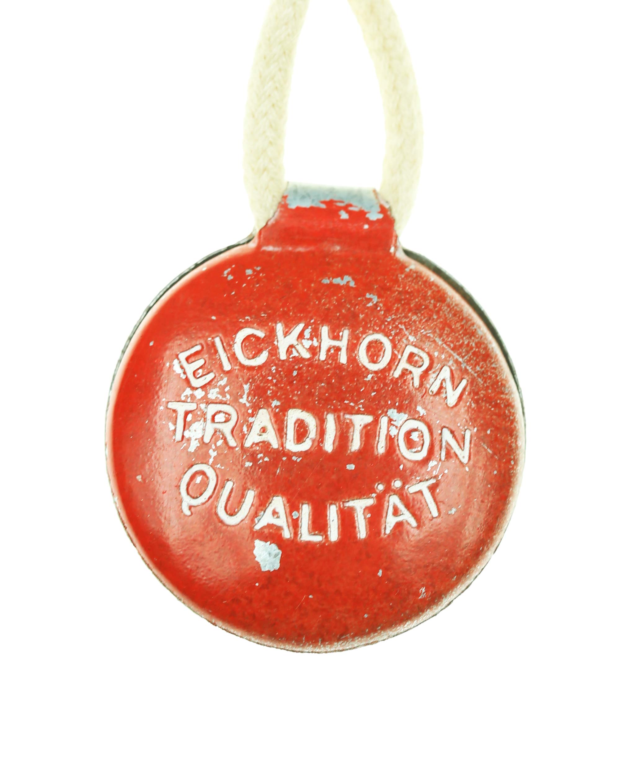Carl Eickhorn quality control tag – red metal tag with raised rim